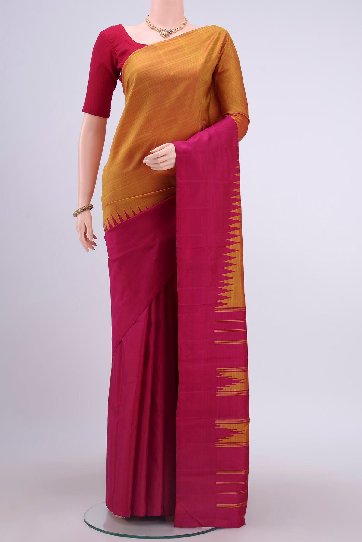 Multi Color Kanchipuram Silk Saree with Plain Body and Rising Temple Border displayed on a mannequin