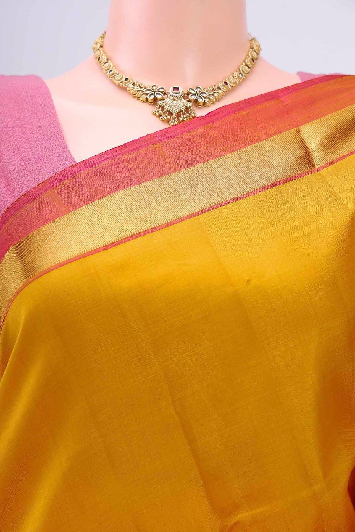 Border image of Mustard Dual Tone Kanchipuram Silk Saree with Zari Butta on the body and Zari Border