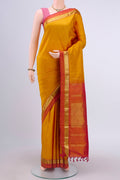 Mustard Dual Tone Kanchipuram Silk Saree with Zari Butta on the body and Zari Border displayed on a mannequin