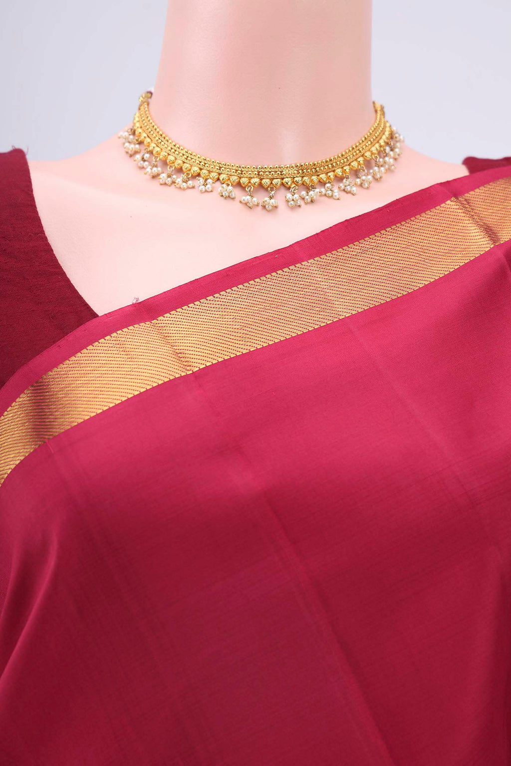 Border image of Maroon Kanchipuram Silk Saree with Plain Body and Zari Border