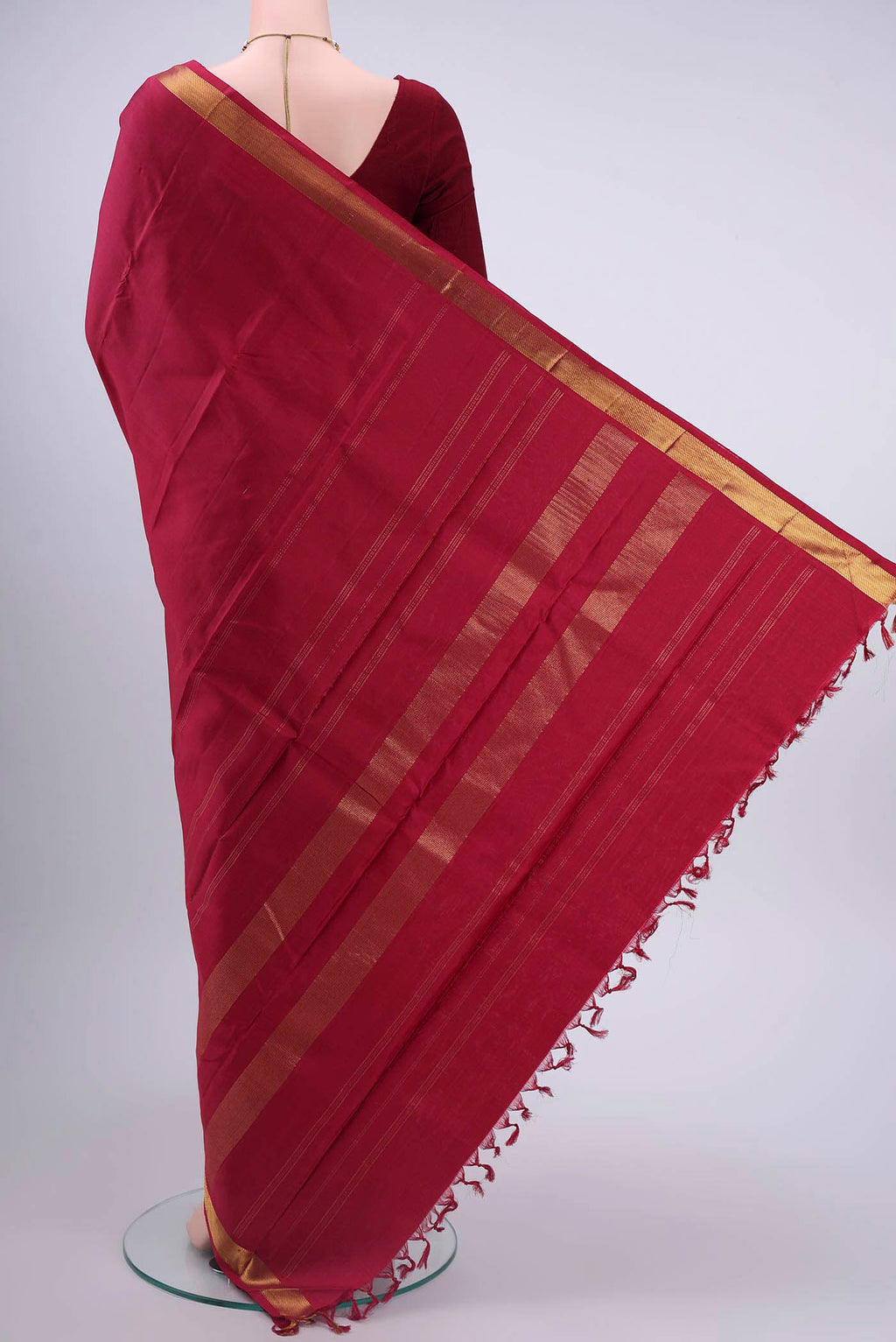 Flat view of Maroon Kanchipuram Silk Saree with Plain Body and Zari Border