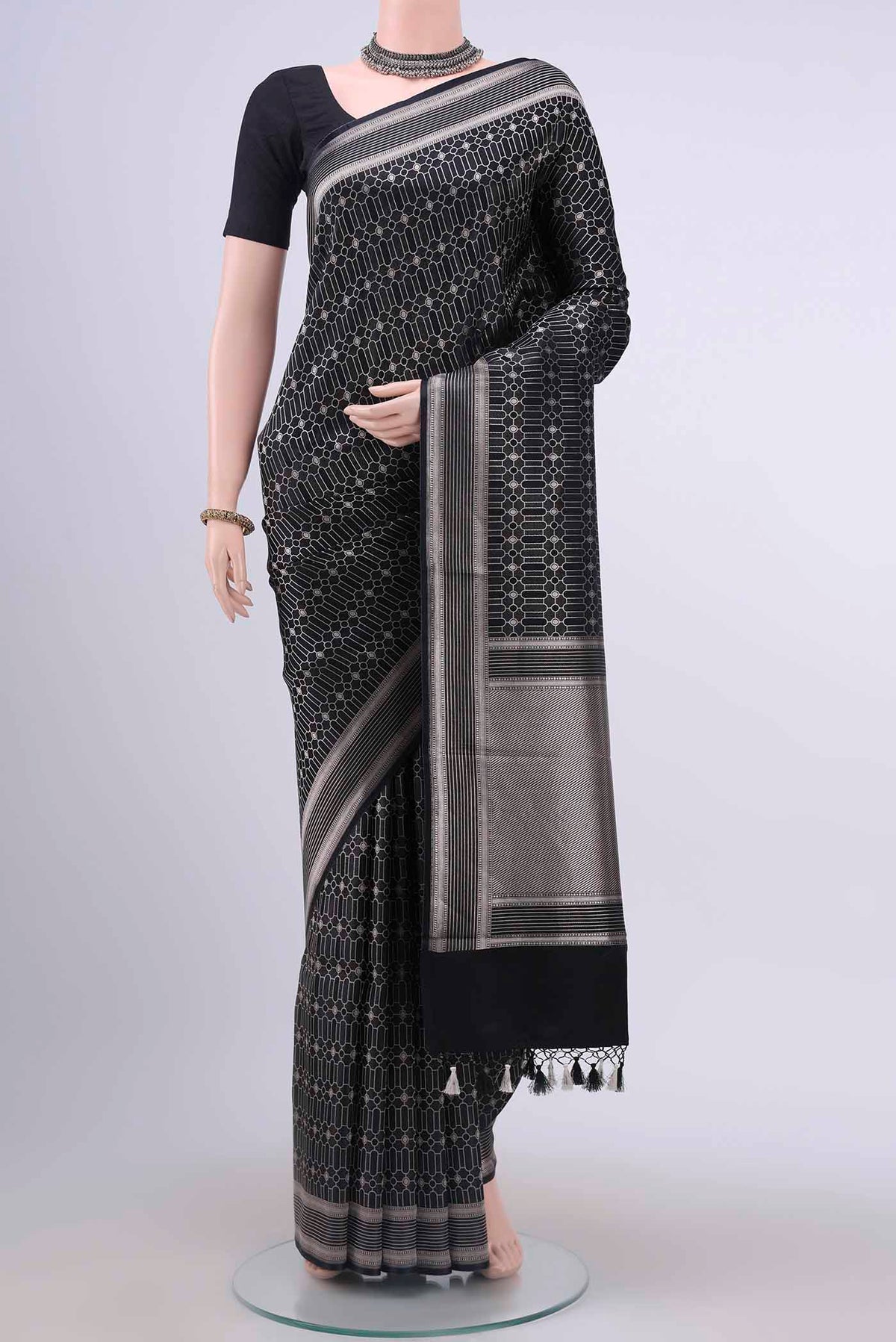Black Dual Tone Banarasi Silk Saree with Zari Brocade on the body and Zari Border displayed on a mannequin