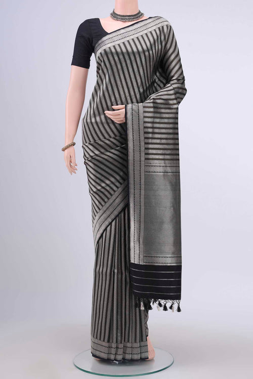Black Dual Tone Banarasi Silk Saree with Stripes on the body and Zari Border displayed on a mannequin