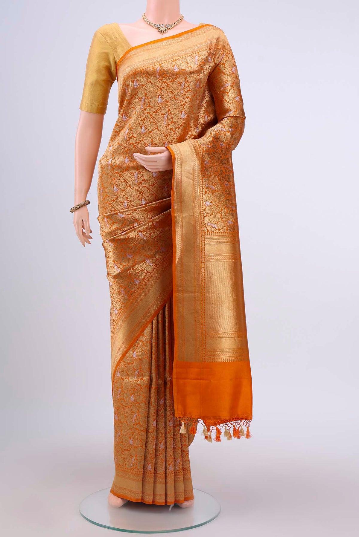 Brick Orange Dual Tone Banarasi Silk Saree with Zari Brocade on the body and Zari Border displayed on a mannequin