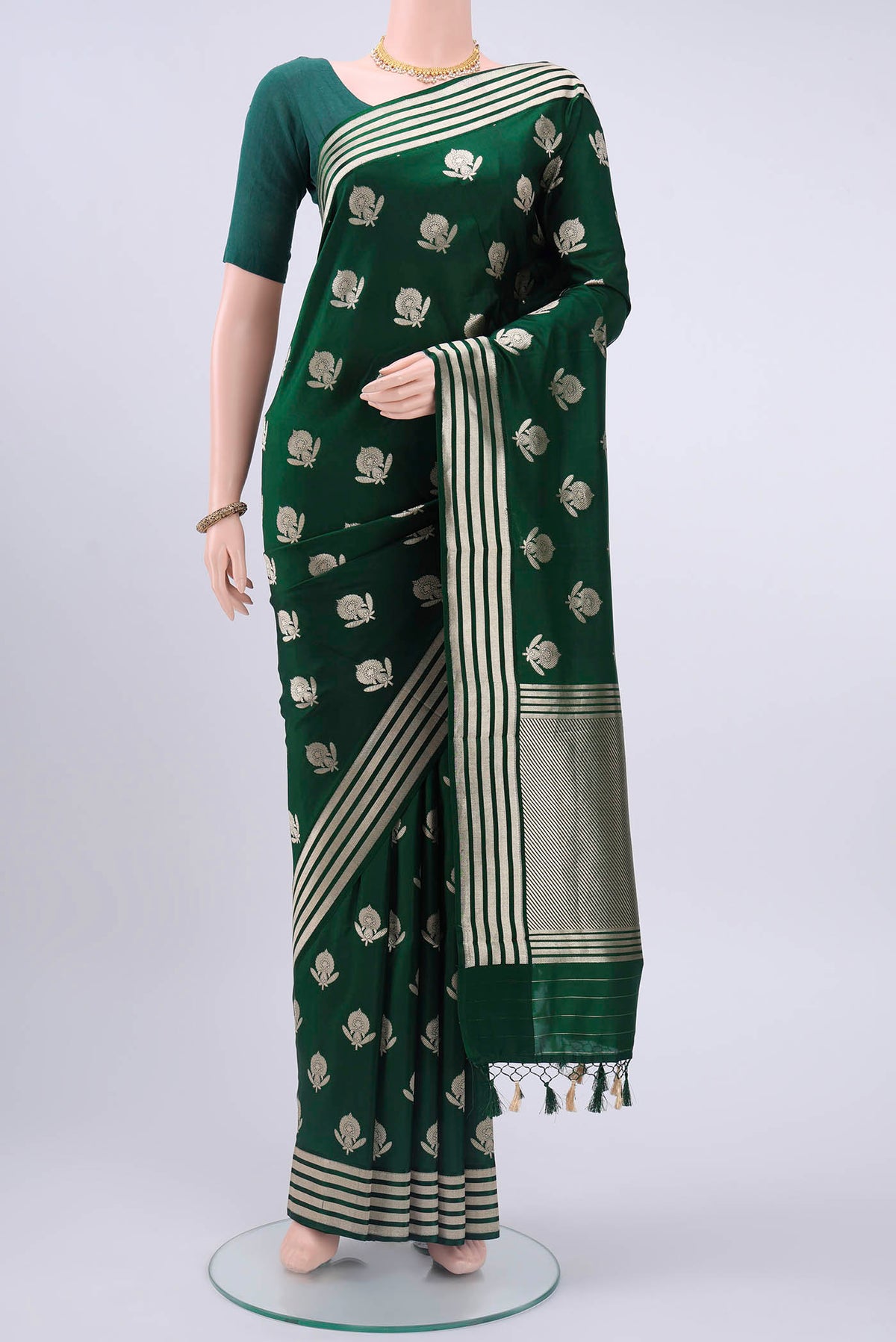 Bottle Green Dual Tone Banarasi Silk Saree with Zari Butta on the body and Zari Border displayed on a mannequin