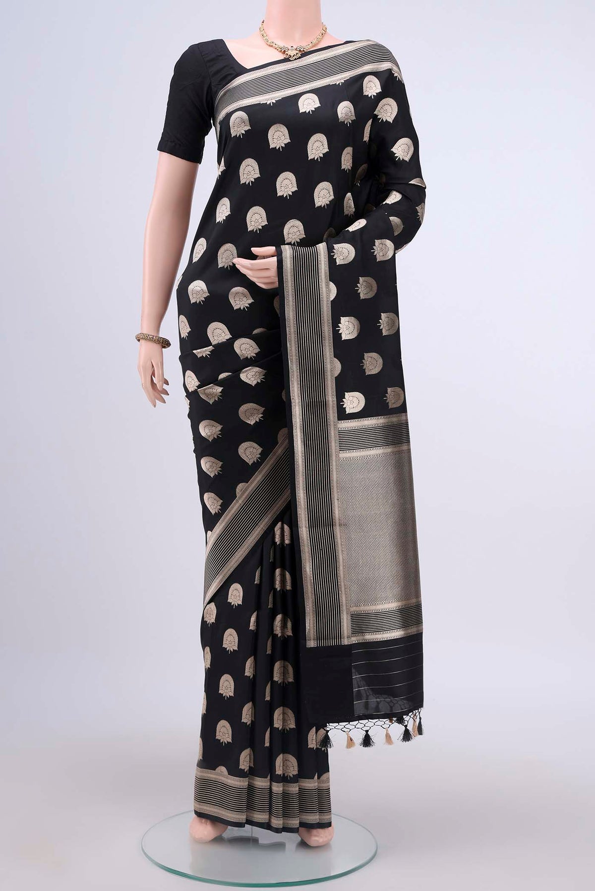 Black Dual Tone Banarasi Silk Saree with Zari Butta on the body and Zari Border displayed on a mannequin