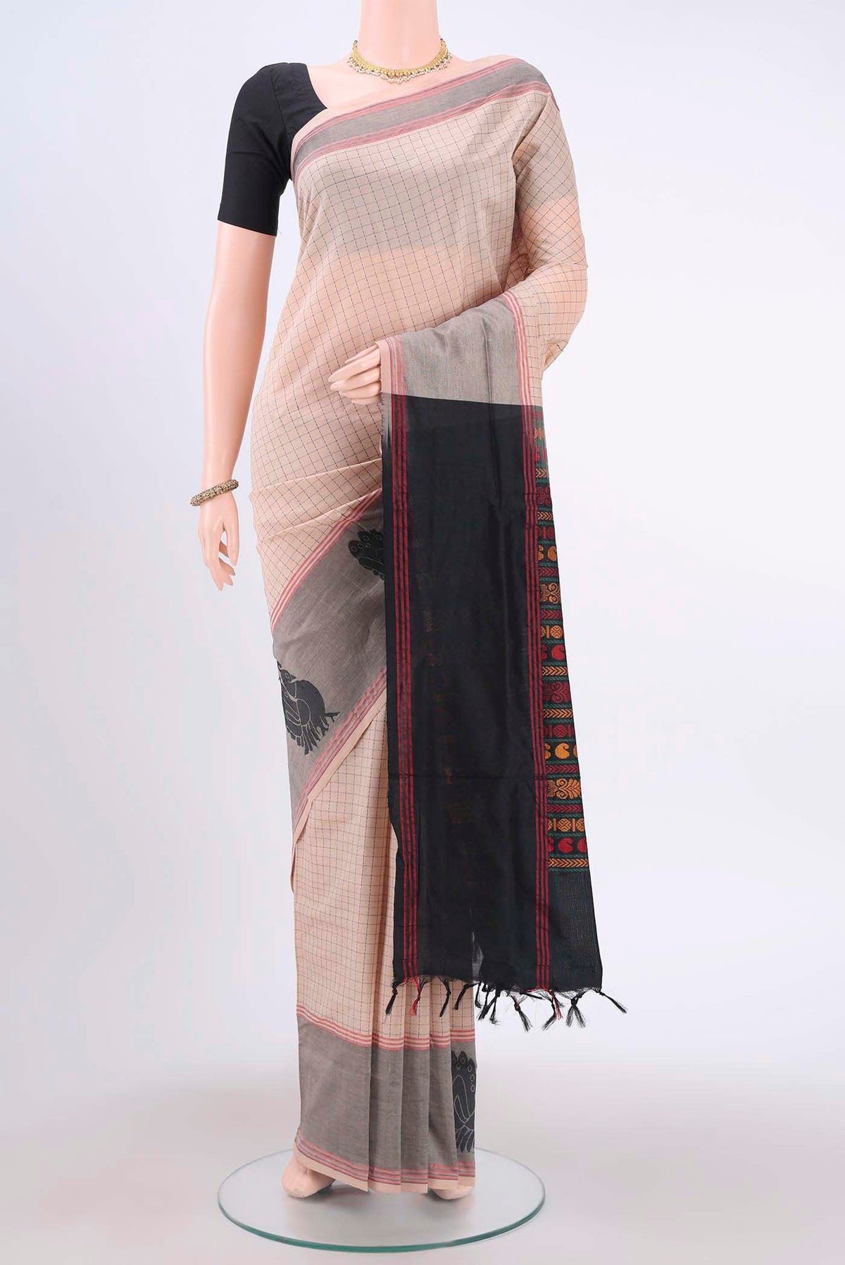 Beige Blended Poly Cotton Saree with Checked design on the body and Thread Border displayed on a mannequin