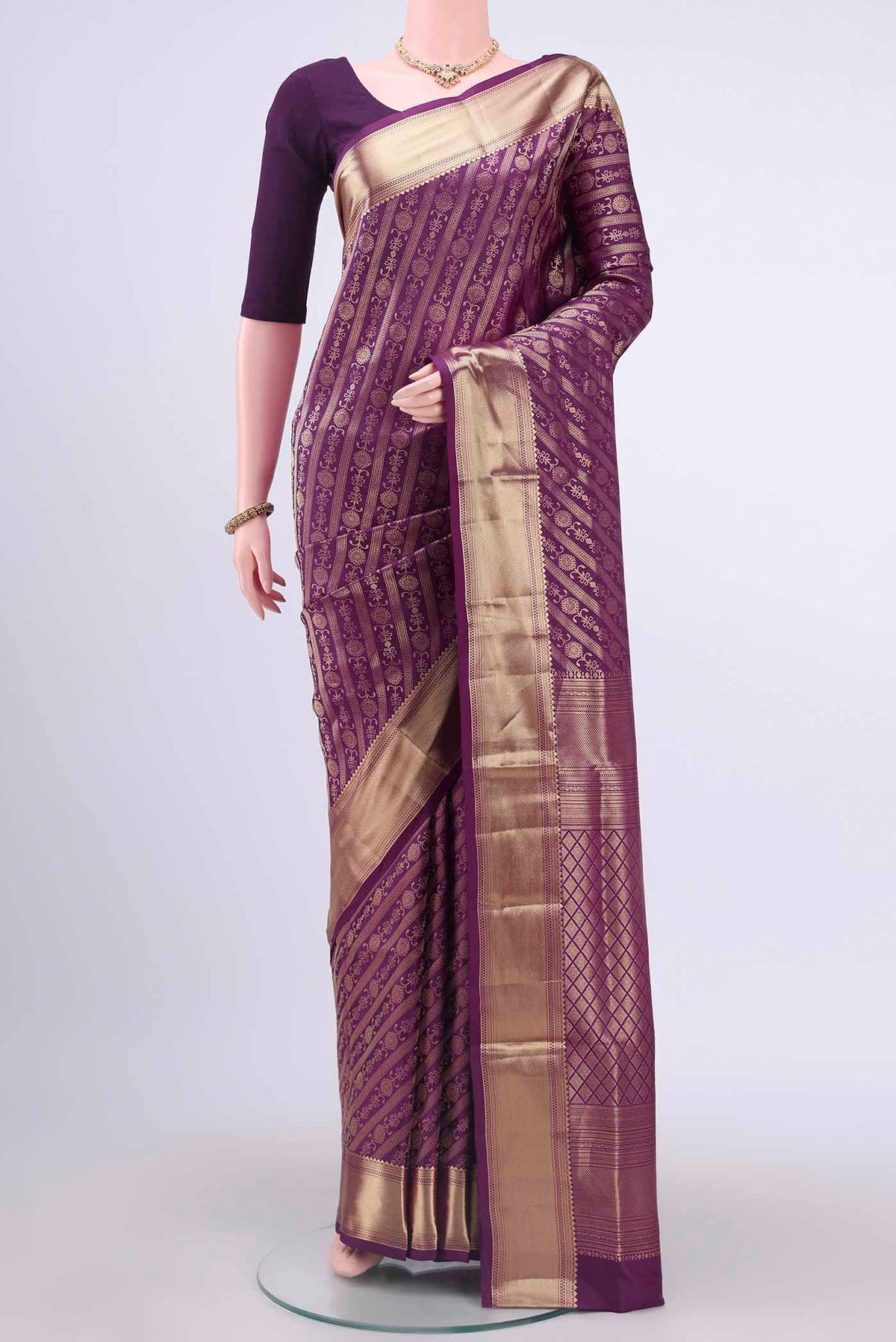 Violet Soft Silk Saree with Zari Brocade on the body and Zari Border displayed on a mannequin