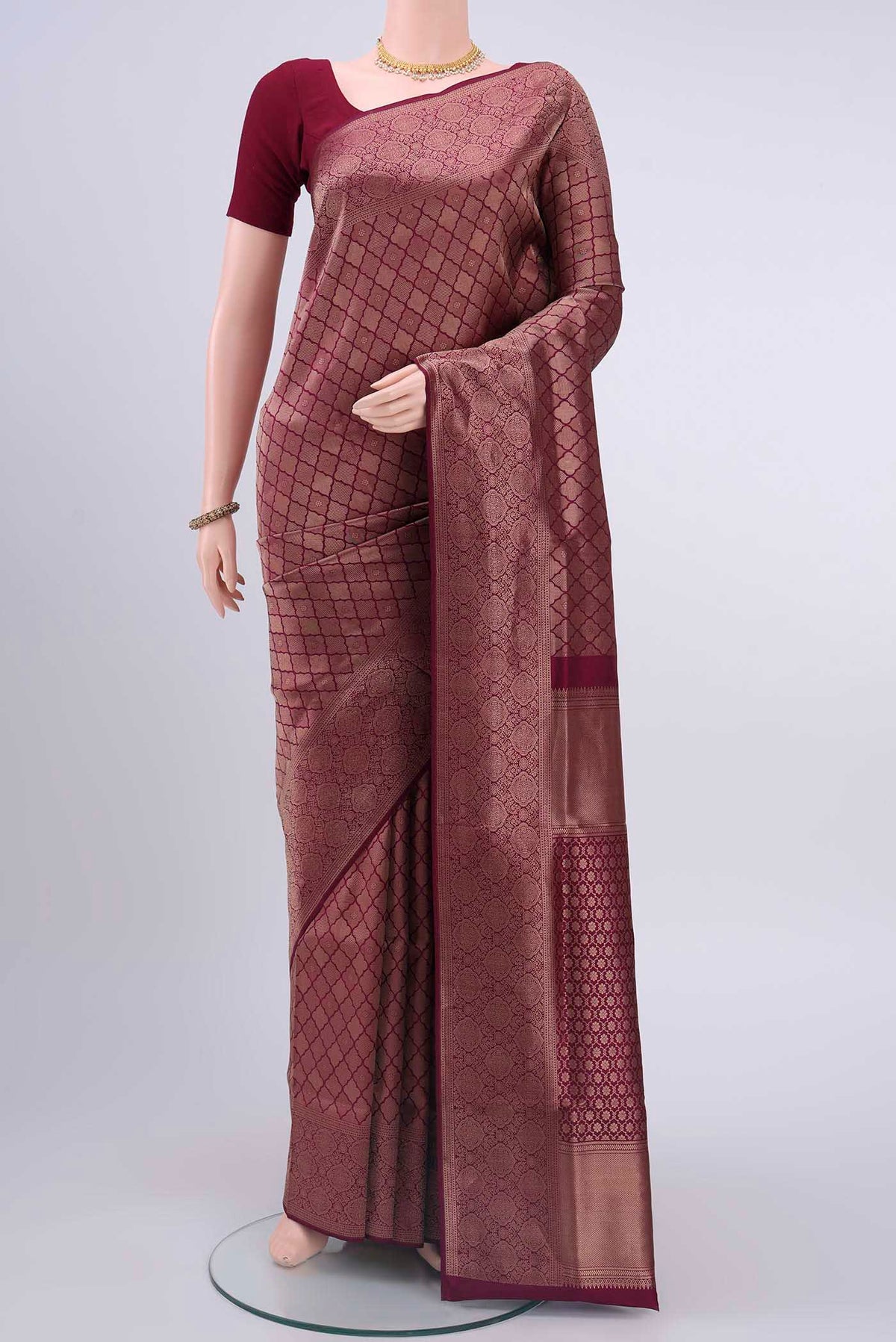 Magenta Soft Silk Saree with Zari Brocade on the body and Zari Border displayed on a mannequin
