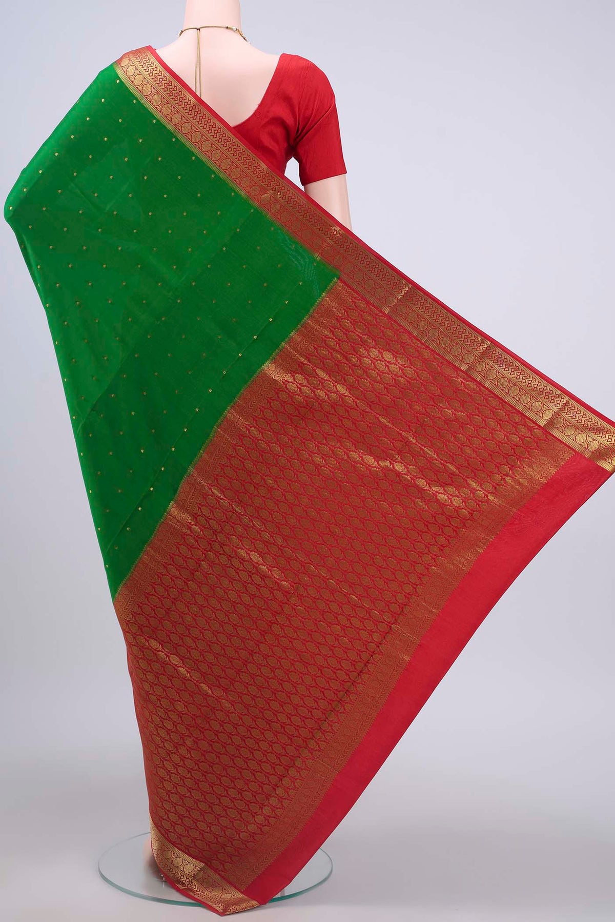 Flat view of Green Mysore Crepe Saree with Zari Butta on the body and Zari Border