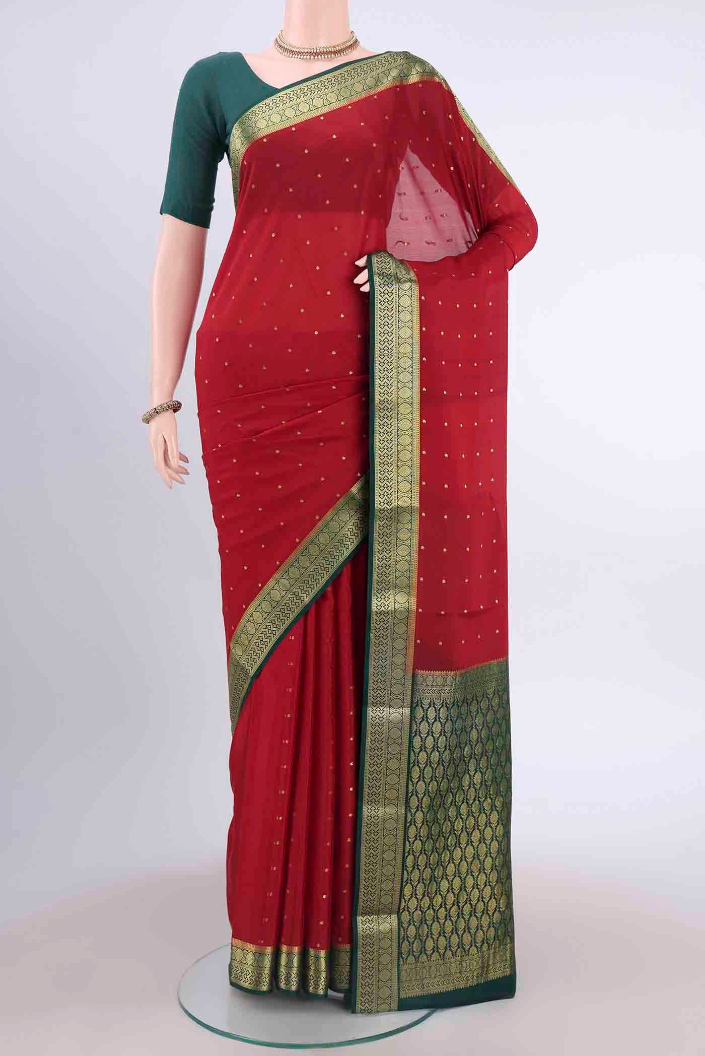 Deep Red Mysore Crepe Saree with Zari Butta on the body and Zari Border displayed on a mannequin