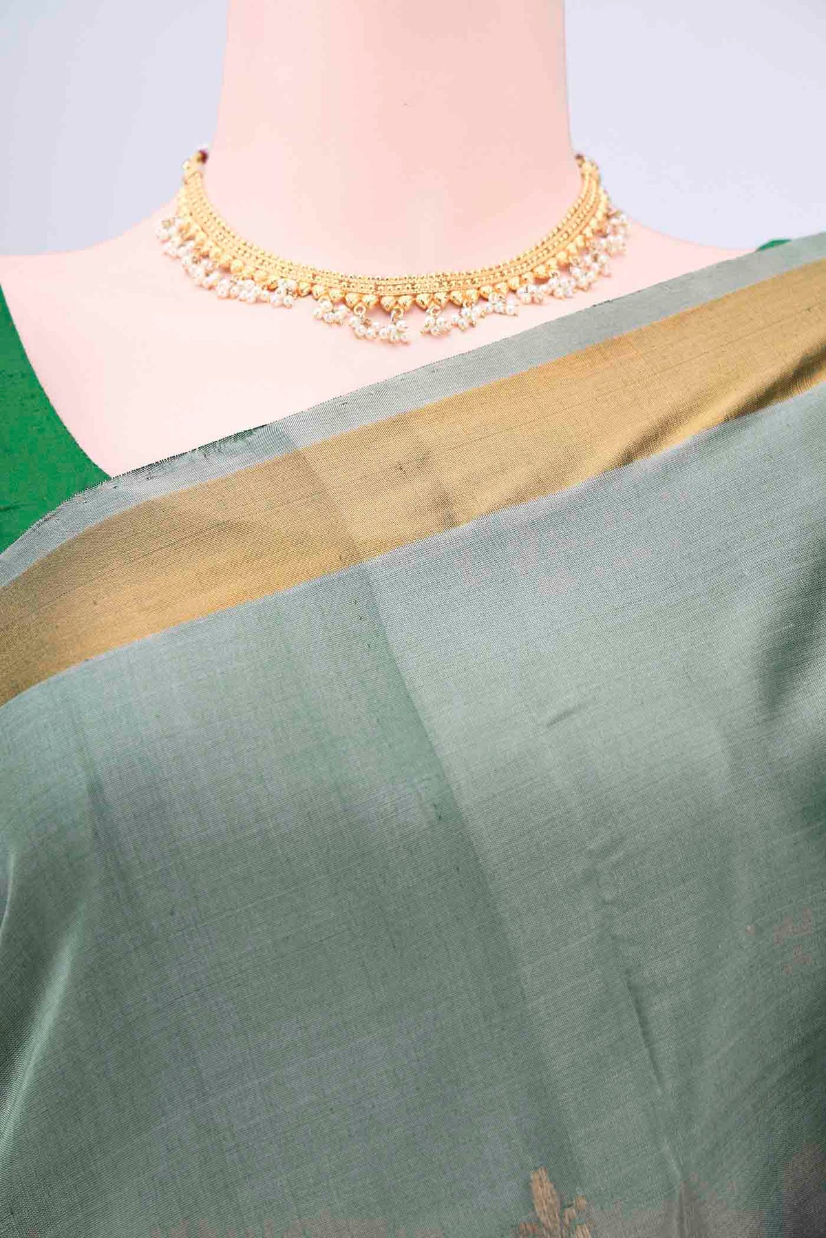 Border image of Grey Uppada Silk Saree with Zari Butta on the body and Zari Border