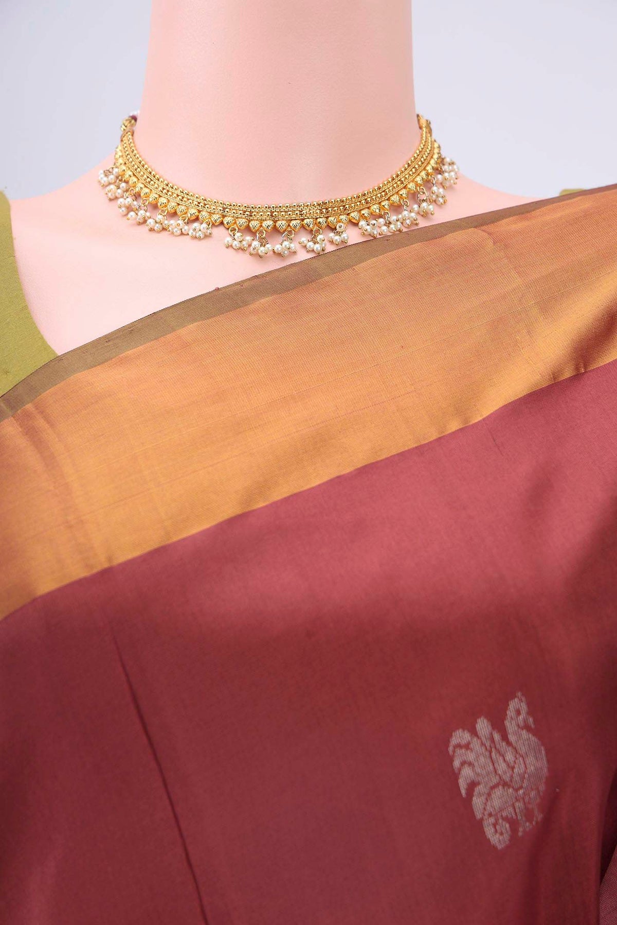 Border image of Maroon Uppada Silk Saree with Zari Butta on the body and Zari Border