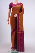 Mustard Uppada Silk Saree with Zari Butta on the body and Zari Border displayed on a mannequin