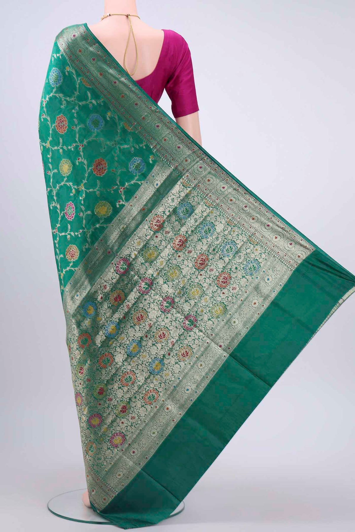 Flat view of Green Banarasi Raw Silk Saree with Zari And Thread Butta on the body and Zari Border