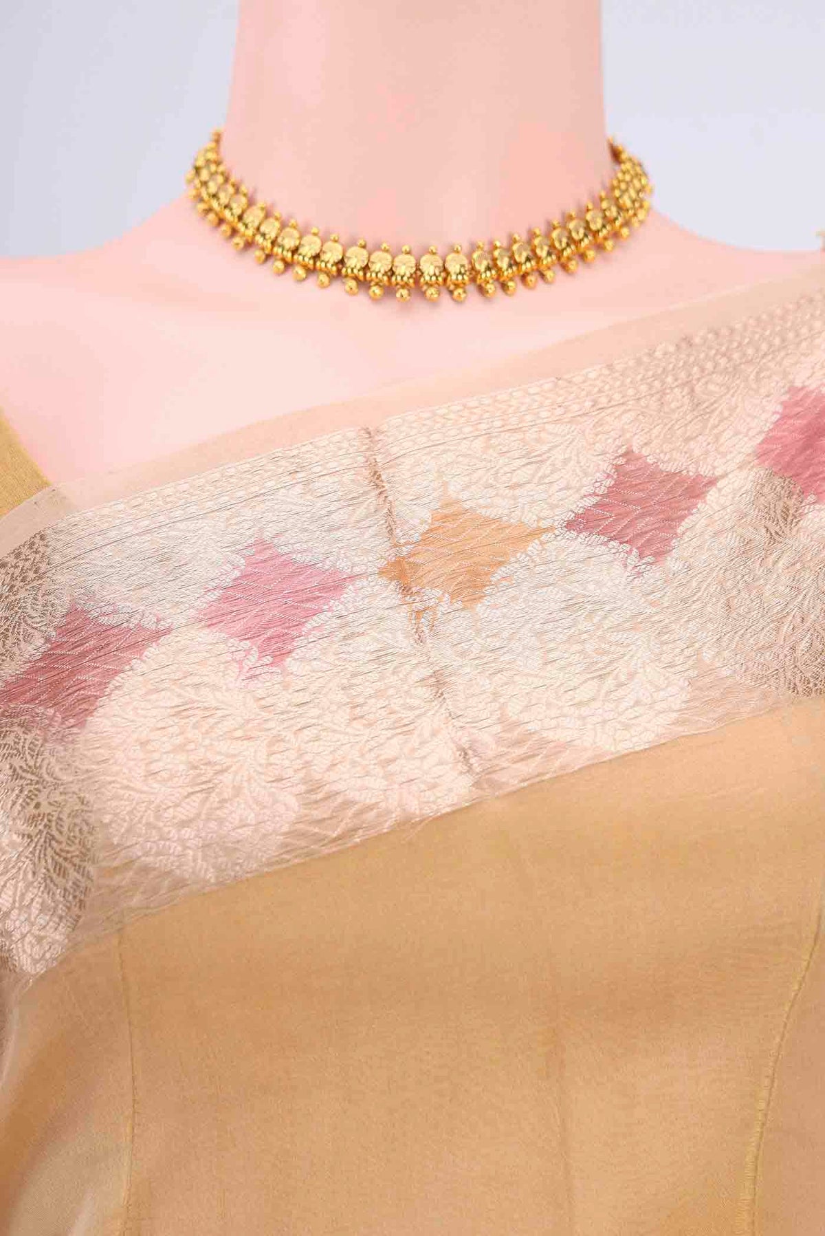 Border image of Beige Organza Silk Saree with Zari Butta on the body and Zari Border