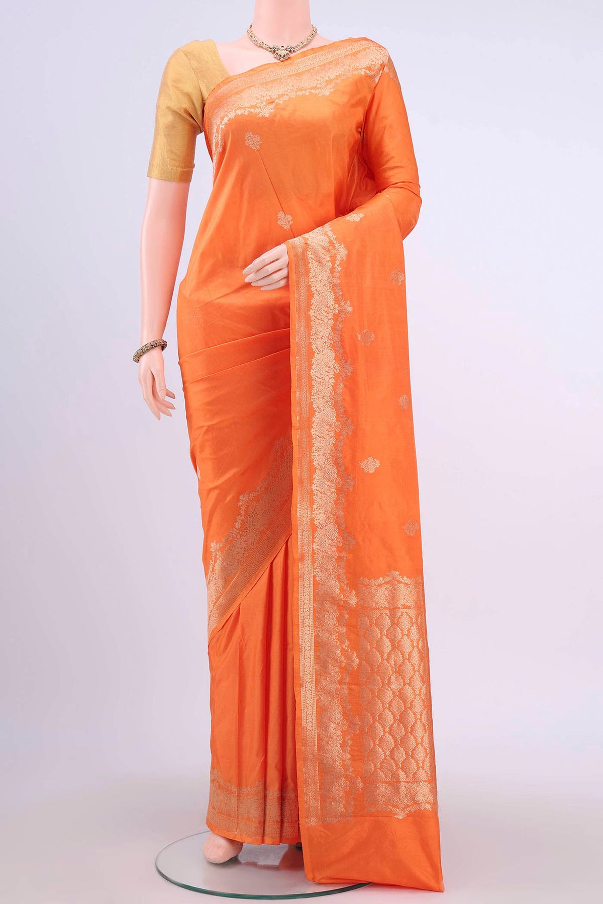 Orange Dual Tone Banarasi Katan Silk Saree with Zari Butta on the body and Zari Border displayed on a mannequin