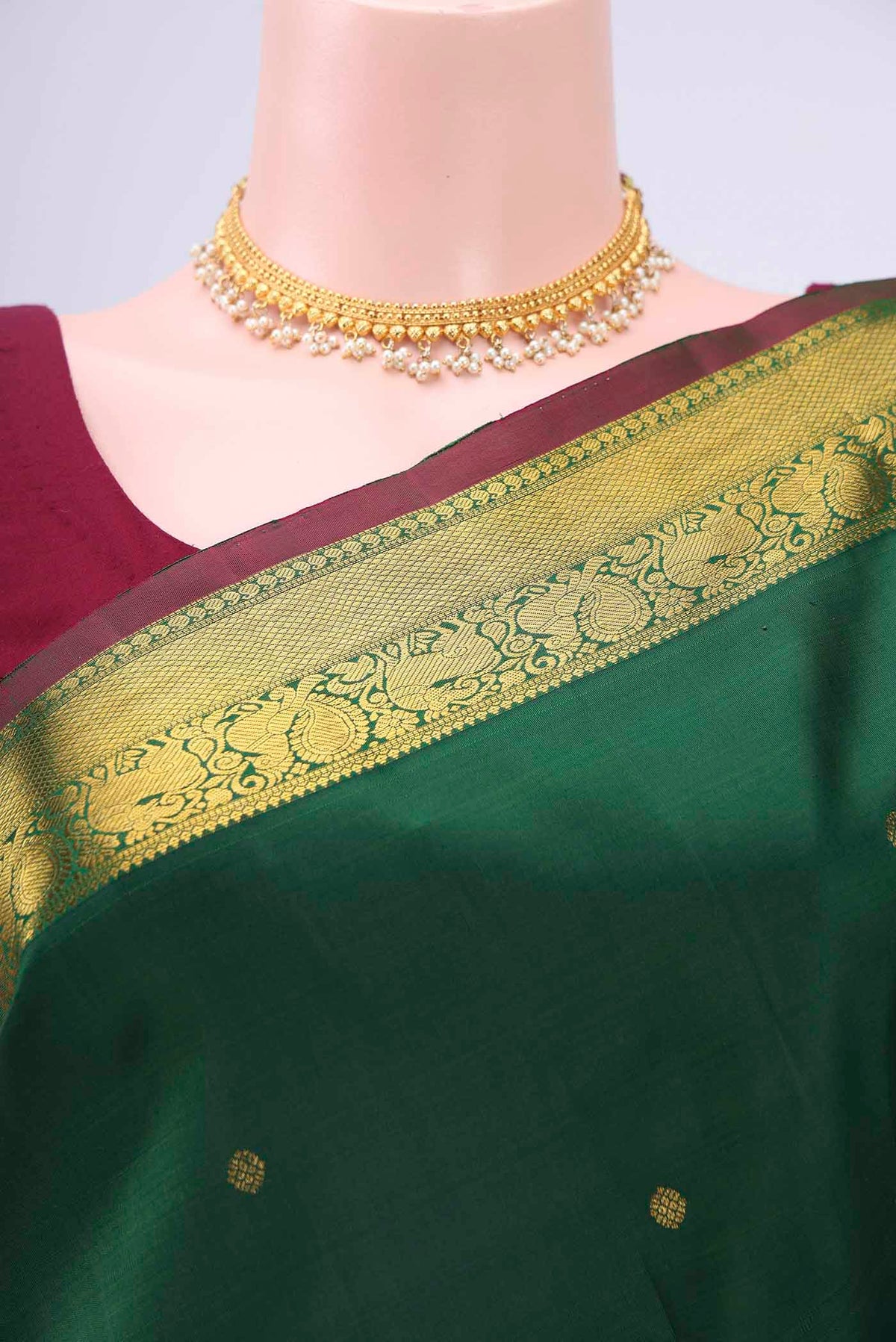 Border image of Bottle Green Kanchipuram Saree with Zari Butta on the body and Zari Border