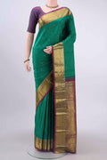 Green Dual Tone Kanchipuram Saree with Zari Butta on the body and Zari Border displayed on a mannequin