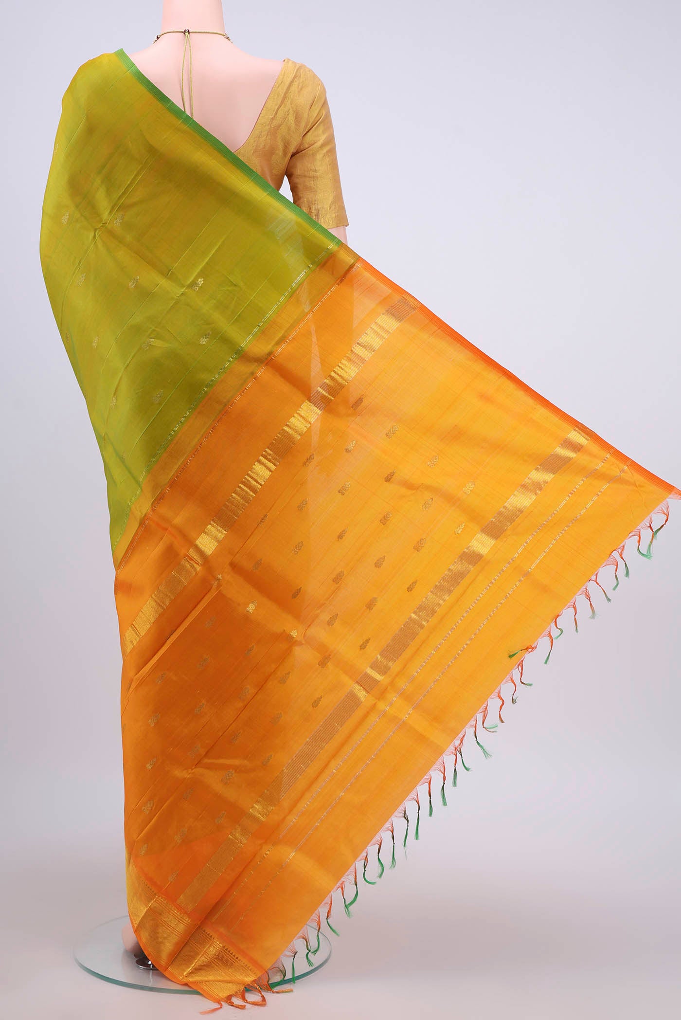 Flat view of Light Green Dual Tone Kanchipuram Silk Saree with Zari Butta on the body and One Side Border