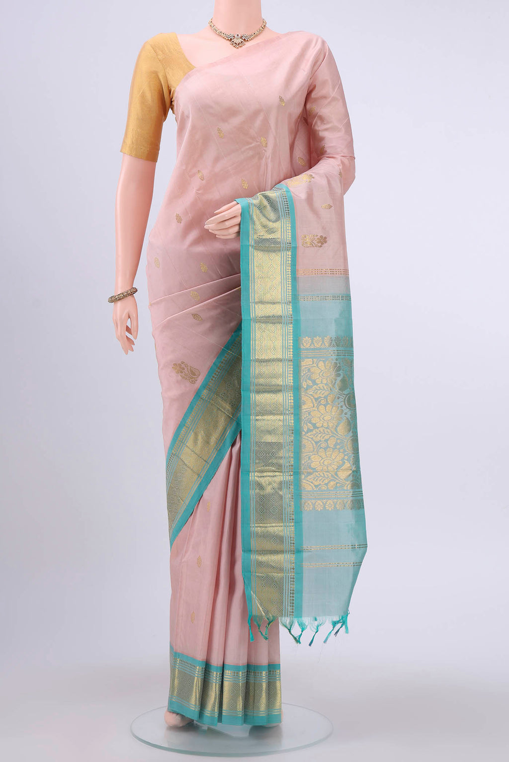 Rose pink Kanchipuram Silk Saree with Zari Butta on the body and One Side Border displayed on a mannequin