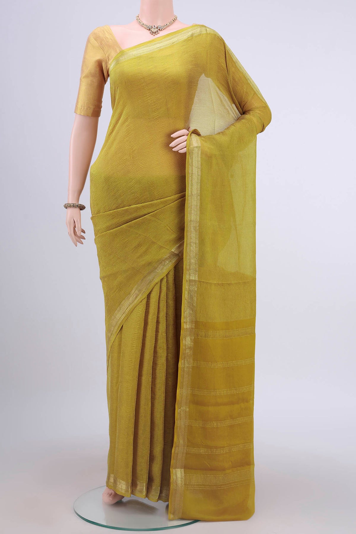 Mehandi Green Mysore Chiffon Saree with Plain Body and Zari Border displayed on a mannequin