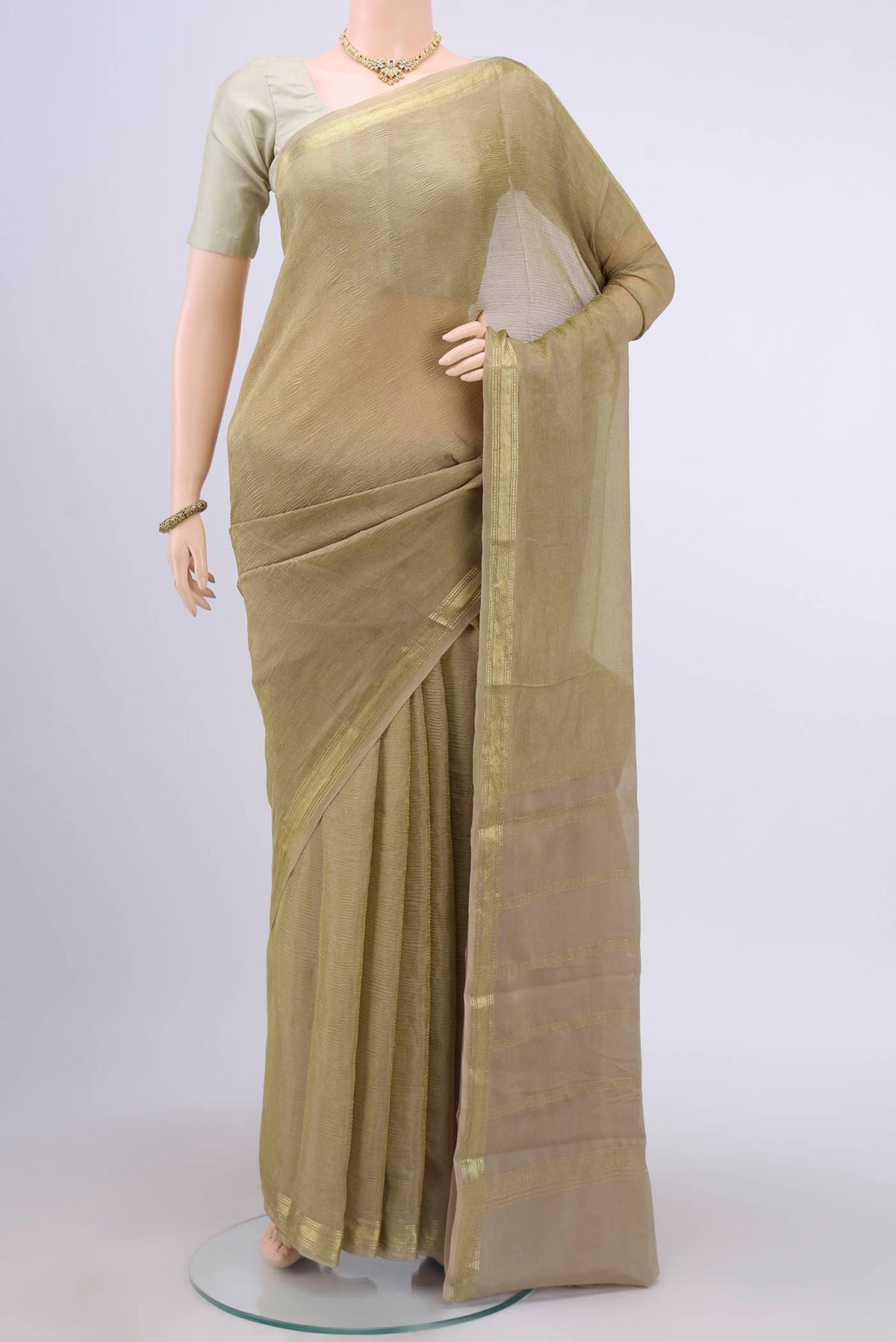 Beige Mysore Chiffon Saree with Plain Body and Zari Border displayed on a mannequin
