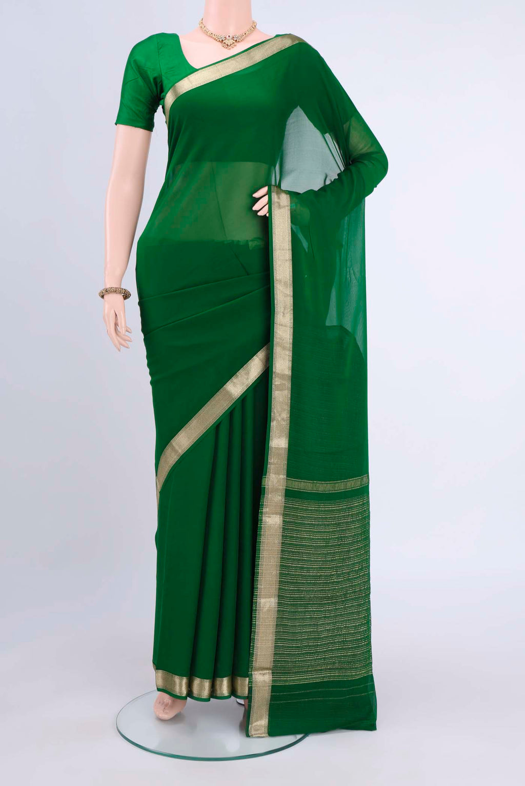 Bottle Green Dual Tone Mysore Chiffon Saree with Plain Body and Zari Border displayed on a mannequin