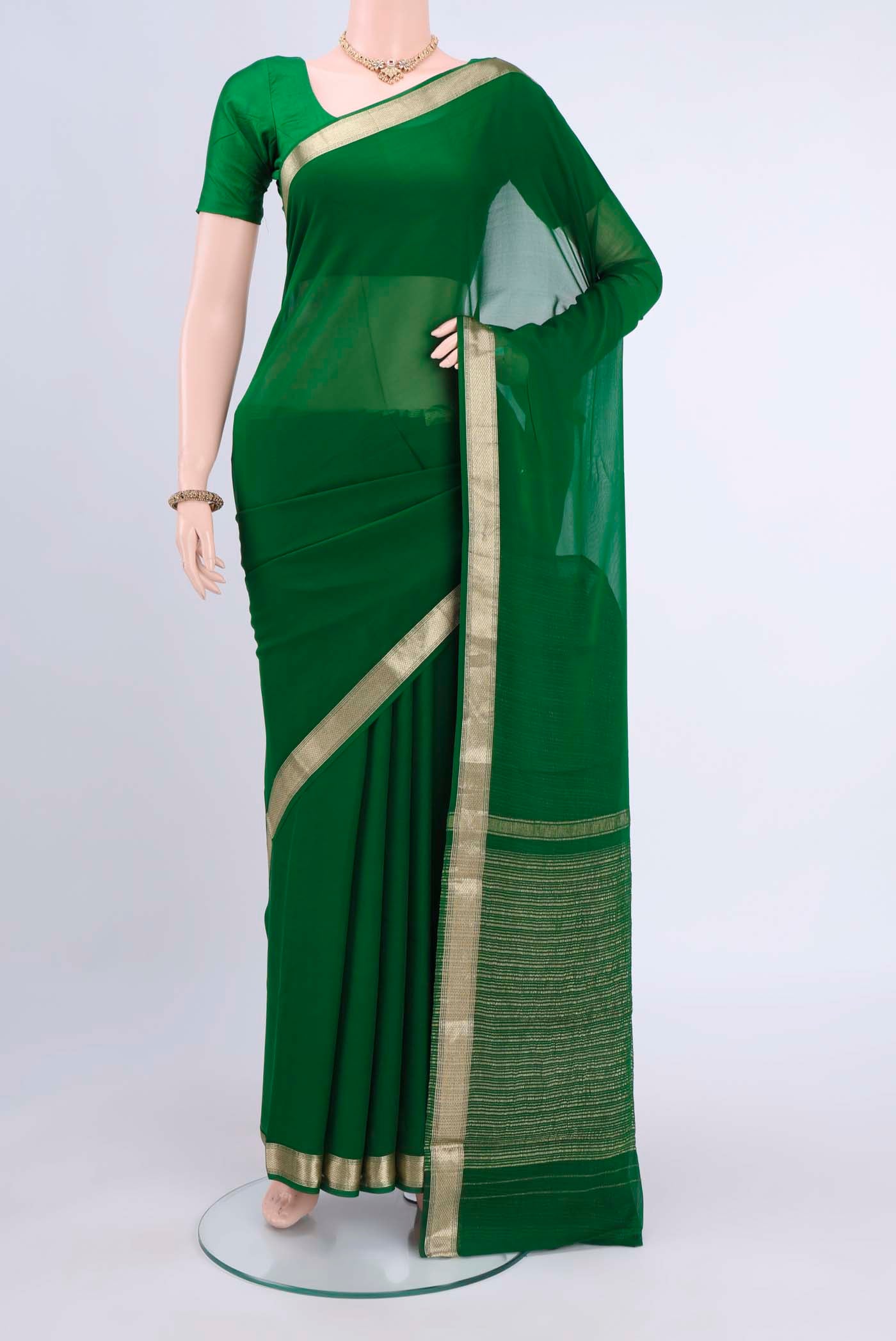 Bottle Green Dual Tone Mysore Chiffon Saree with Plain Body and Zari Border displayed on a mannequin