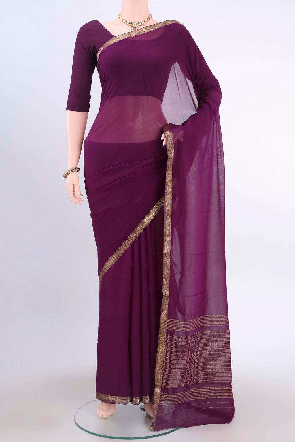 Violet Mysore Georgette Saree with Plain Body and Zari Border displayed on a mannequin