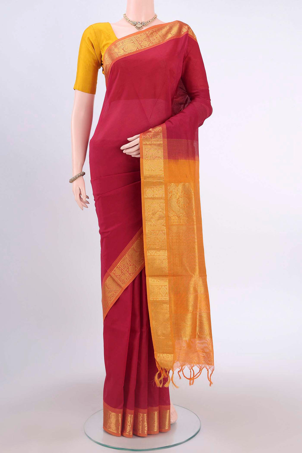 Red Silk Cotton Saree with Plain Body and Zari Border displayed on a mannequin