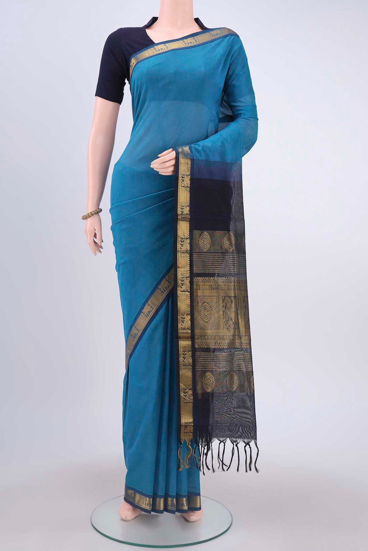 Blue Silk Cotton Saree with Plain Body and Zari Border displayed on a mannequin