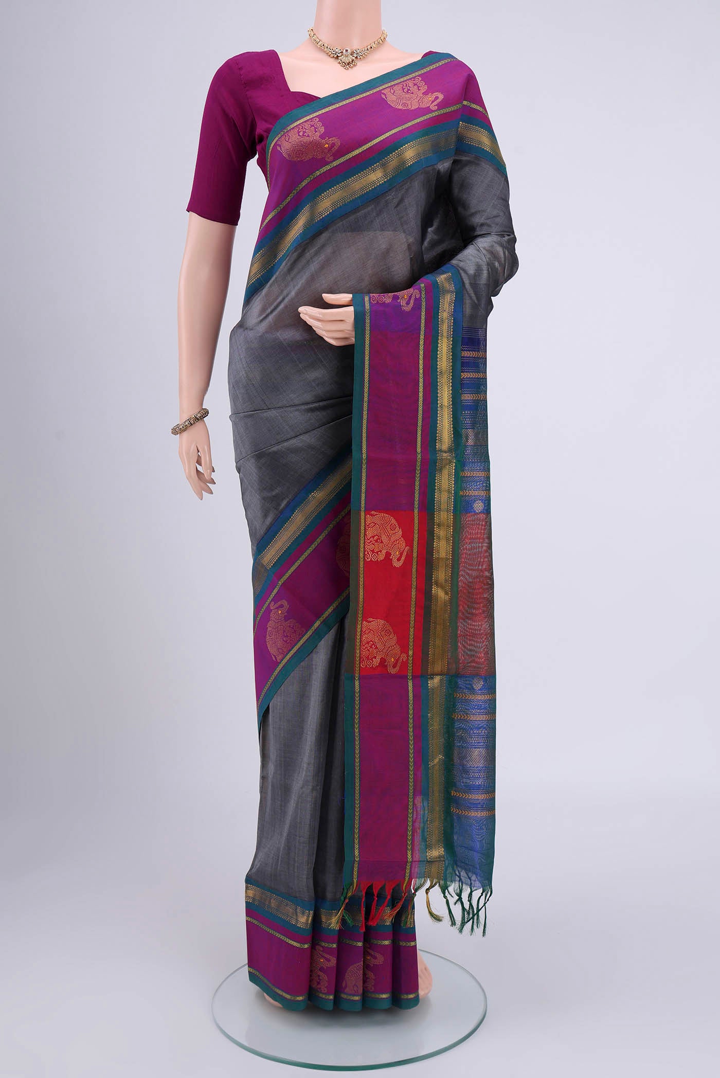 Grey Blended Coimbatore Silk Cotton Saree with Plain Body and Zari Border.  displayed on a mannequin
