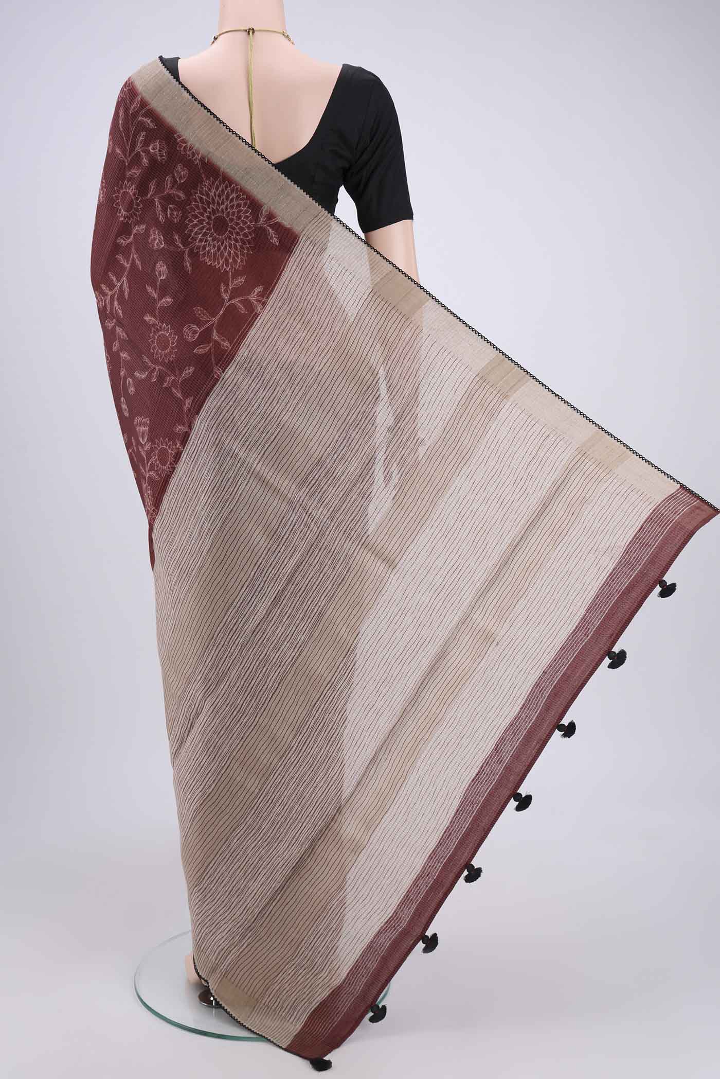Flat view of Brown Tussar Silk Saree with Printed design on the body and Fancy Border. 