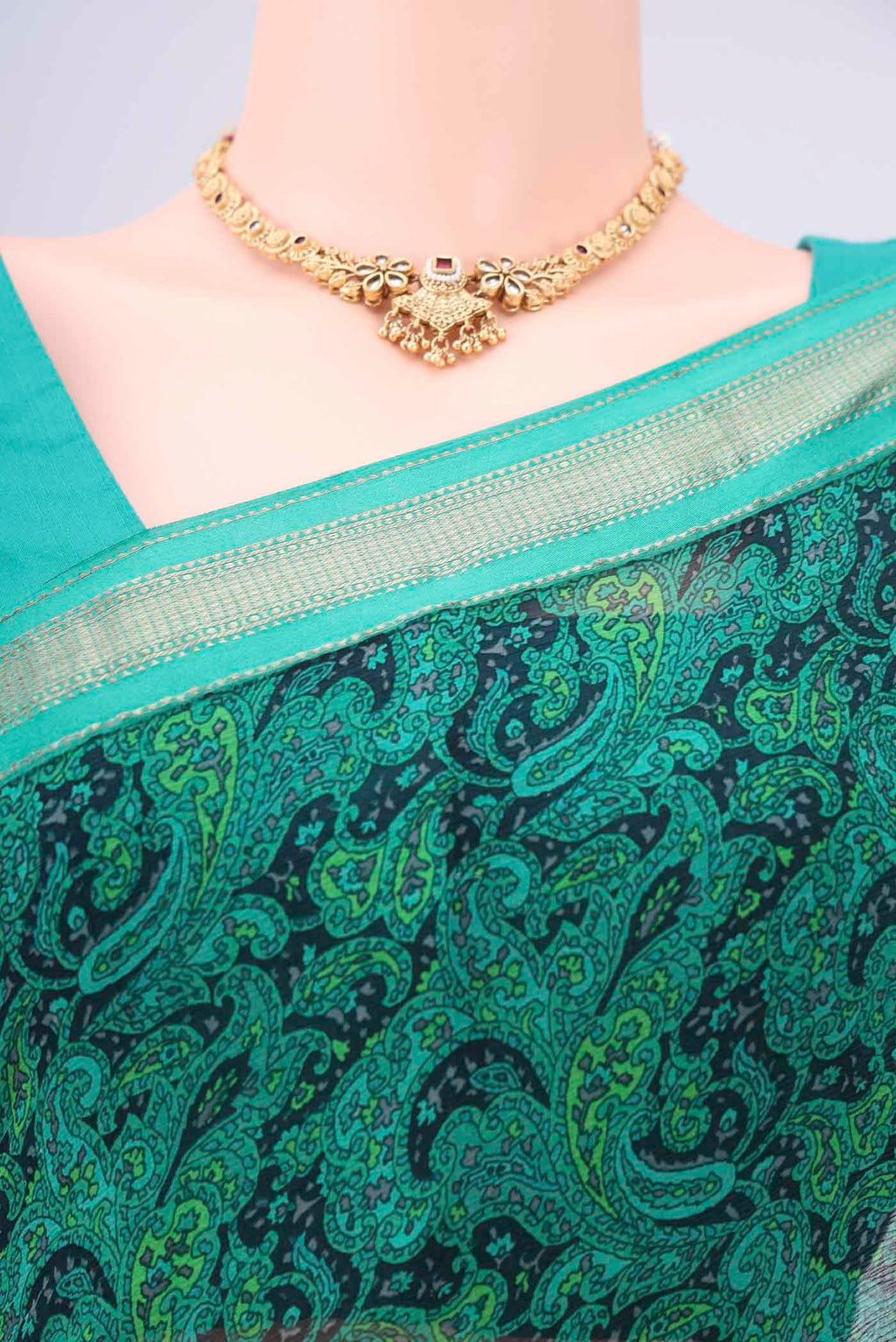 Border image of Sea Green Mysore Crepe Saree with Floral Print on the body and Zari Border. 