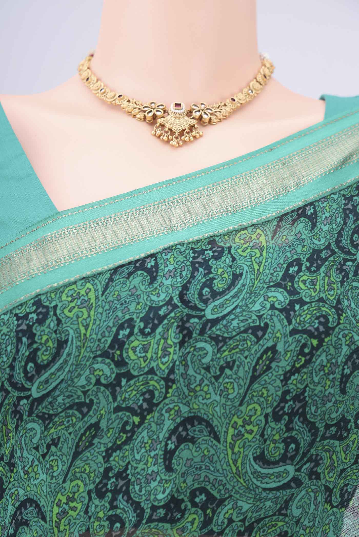 Border image of Sea Green Mysore Crepe Saree with Floral Print on the body and Zari Border. 