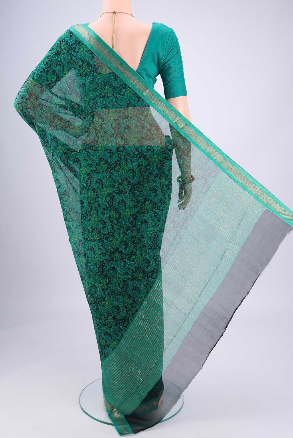 Flat view of Sea Green Mysore Crepe Saree with Floral Print on the body and Zari Border. 