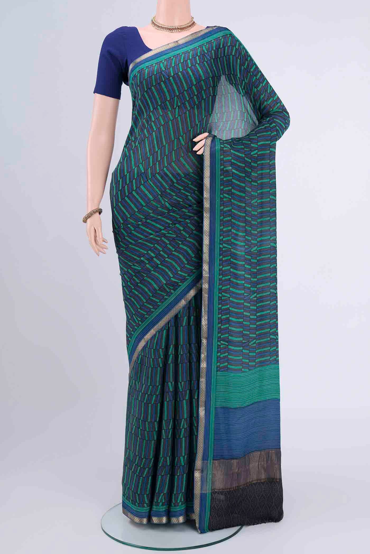 Multi Color Mysore Crepe Saree with Geometric Print on the body and Zari Border displayed on a mannequin