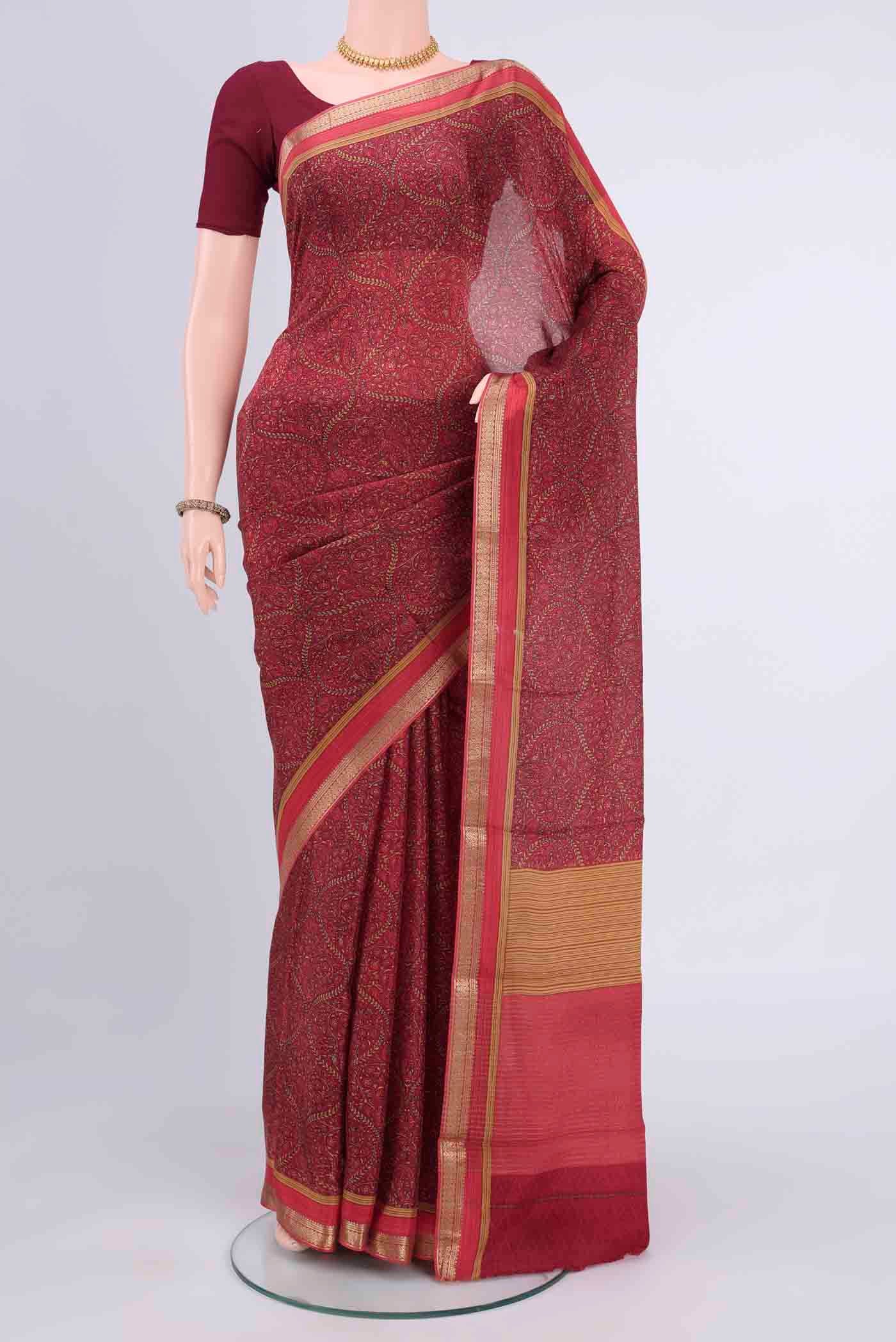 Magenta Mysore Crepe Saree with Floral Print on the body and Zari Border displayed on a mannequin