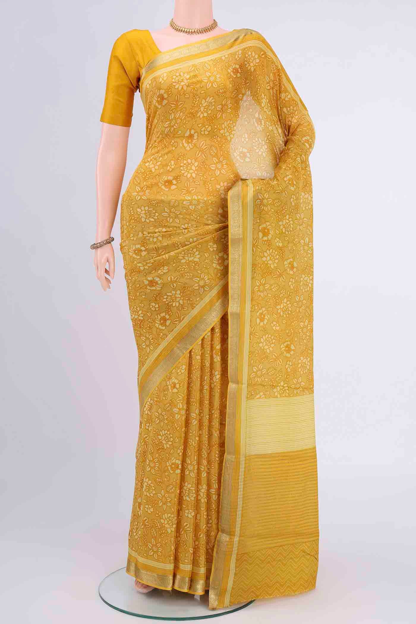 Yellow Mysore Crepe Saree with Floral Print on the body and Printed Border displayed on a mannequin
