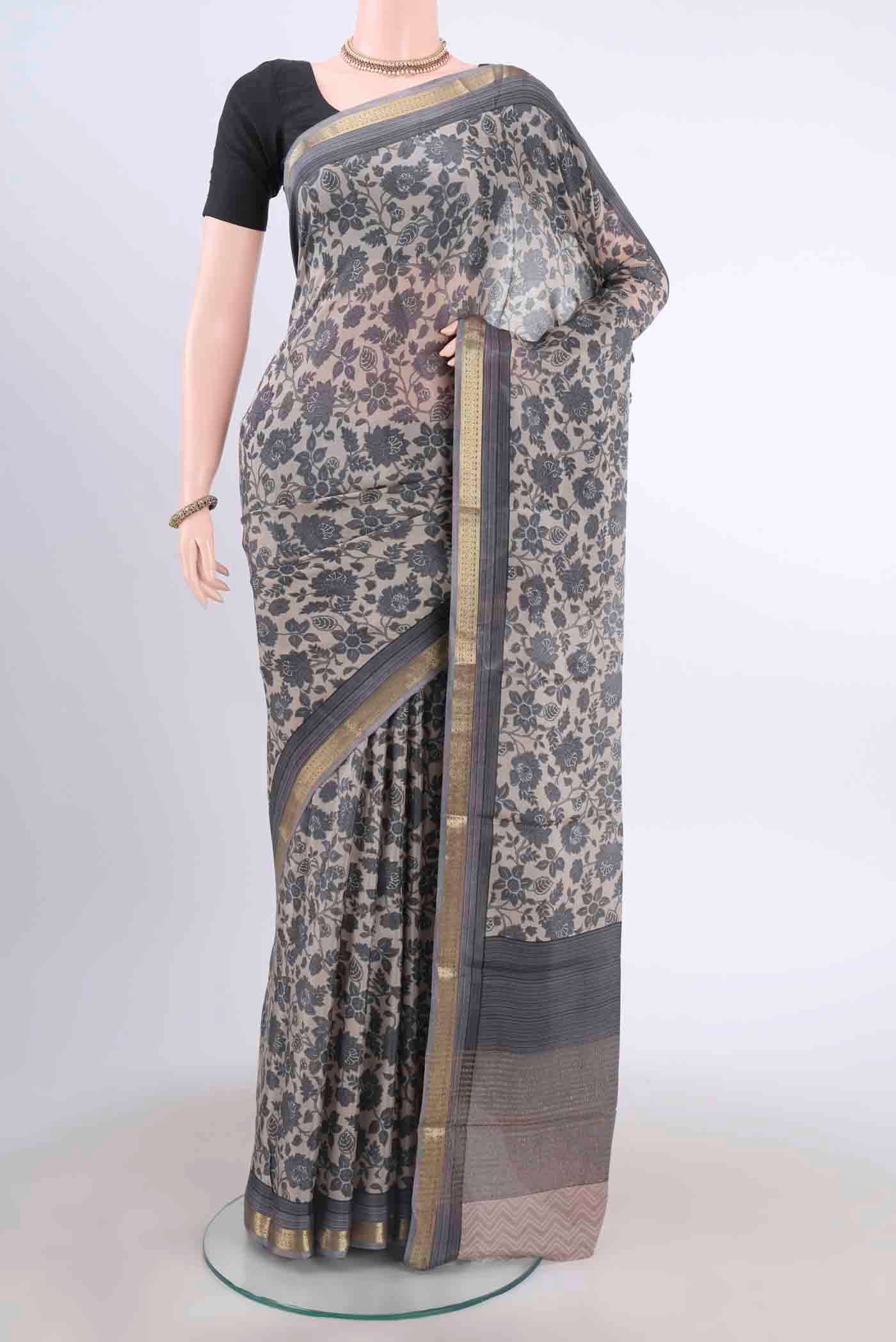 Davys Grey Mysore Crepe Saree with Floral Print on the body and Printed Border displayed on a mannequin