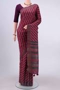 Magenta Tussar Silk Saree with Checked design on the body and Zari Border displayed on a mannequin