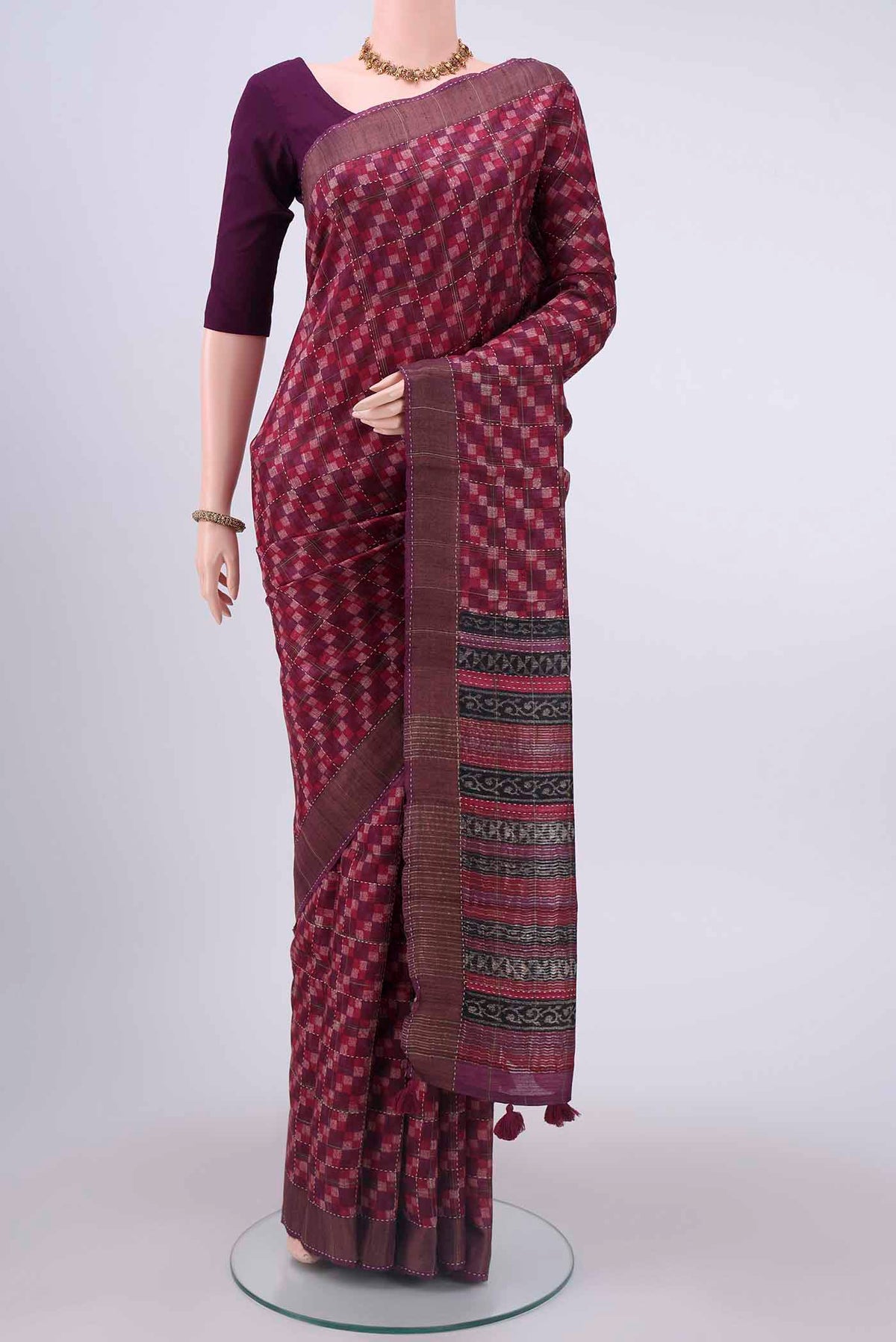 Magenta Tussar Silk Saree with Checked design on the body and Zari Border displayed on a mannequin