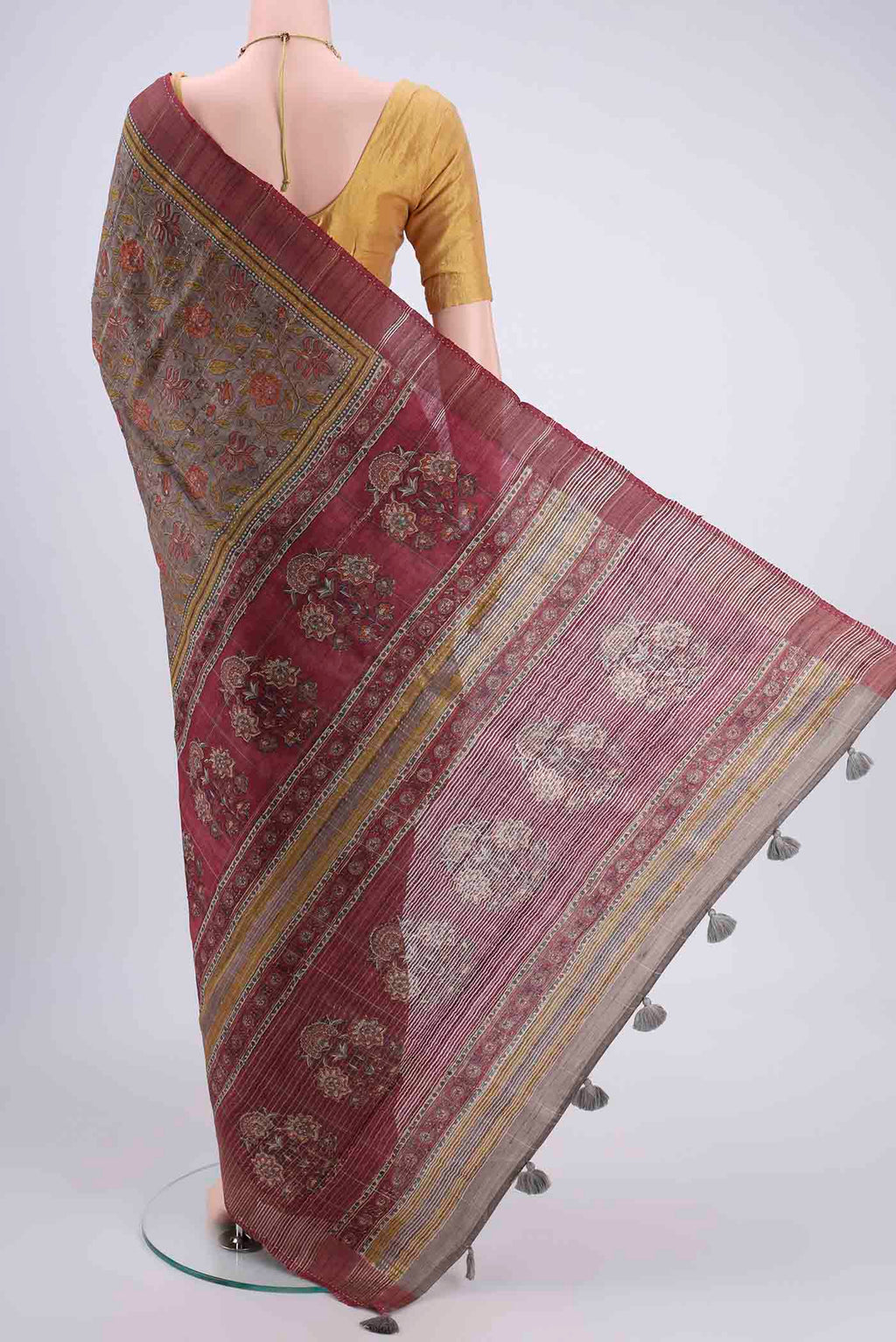 Flat view of Davys Grey Tussar Silk Saree with Printed design on the body and Fancy Border. 
