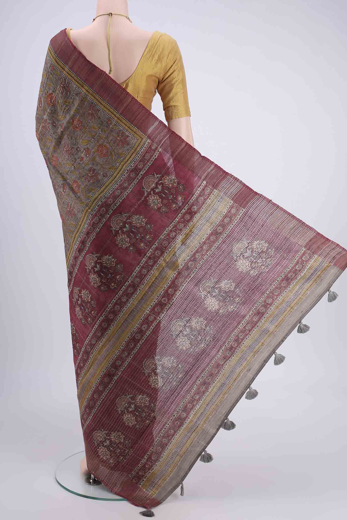 Flat view of Davys Grey Tussar Silk Saree with Printed design on the body and Fancy Border. 