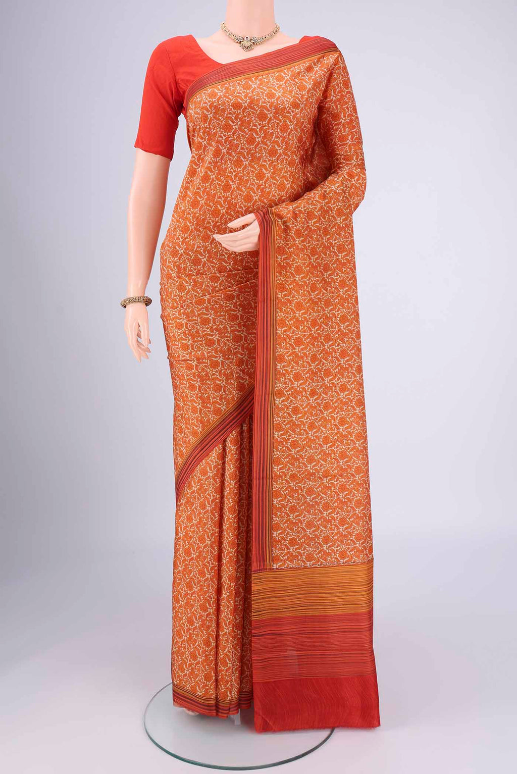 Beige Dual Tone Printed Silk Saree with Printed design on the body and Zari Border.  displayed on a mannequin
