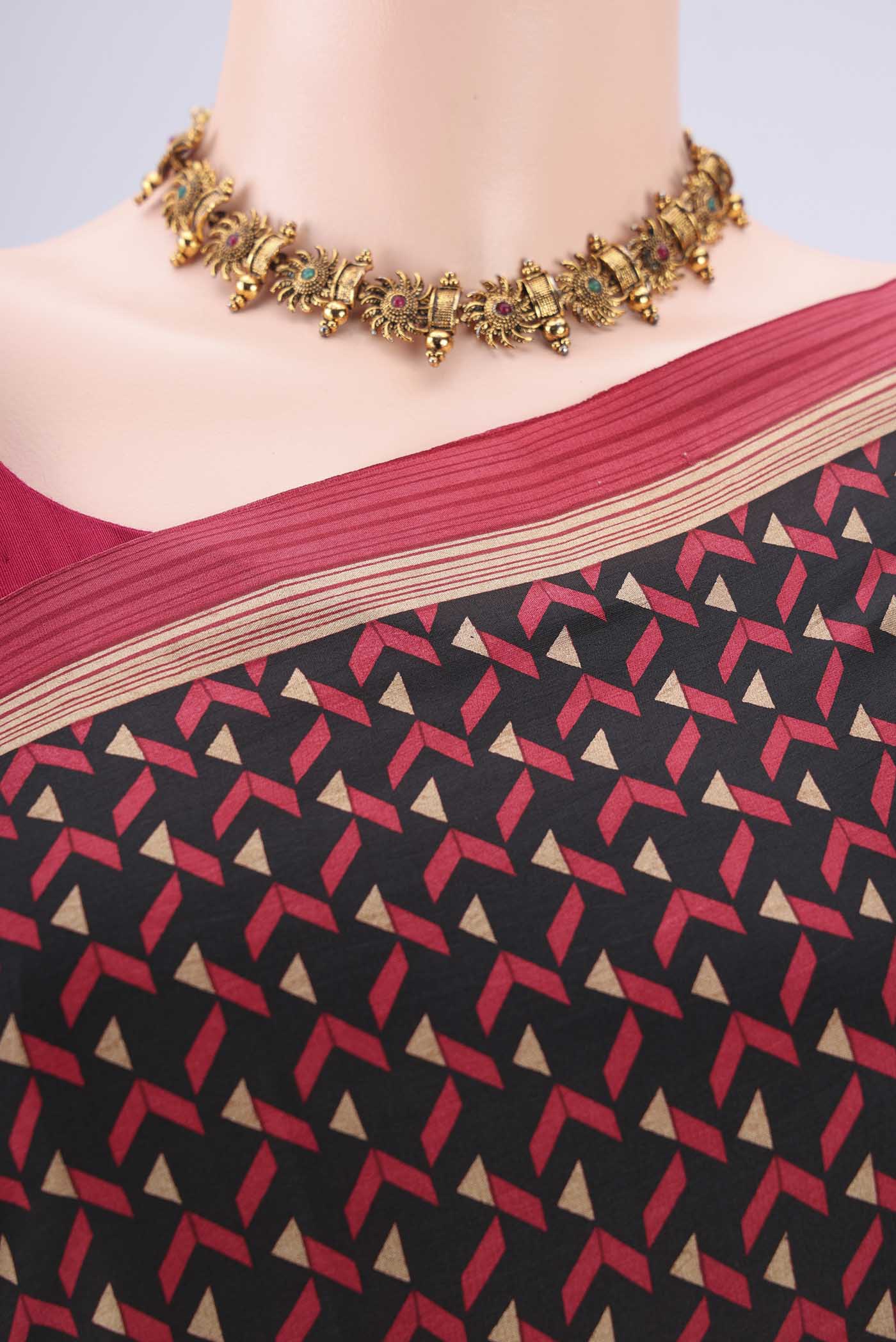 Border image of Black Printed Silk Saree with Floral Print on the body and Printed Border. 