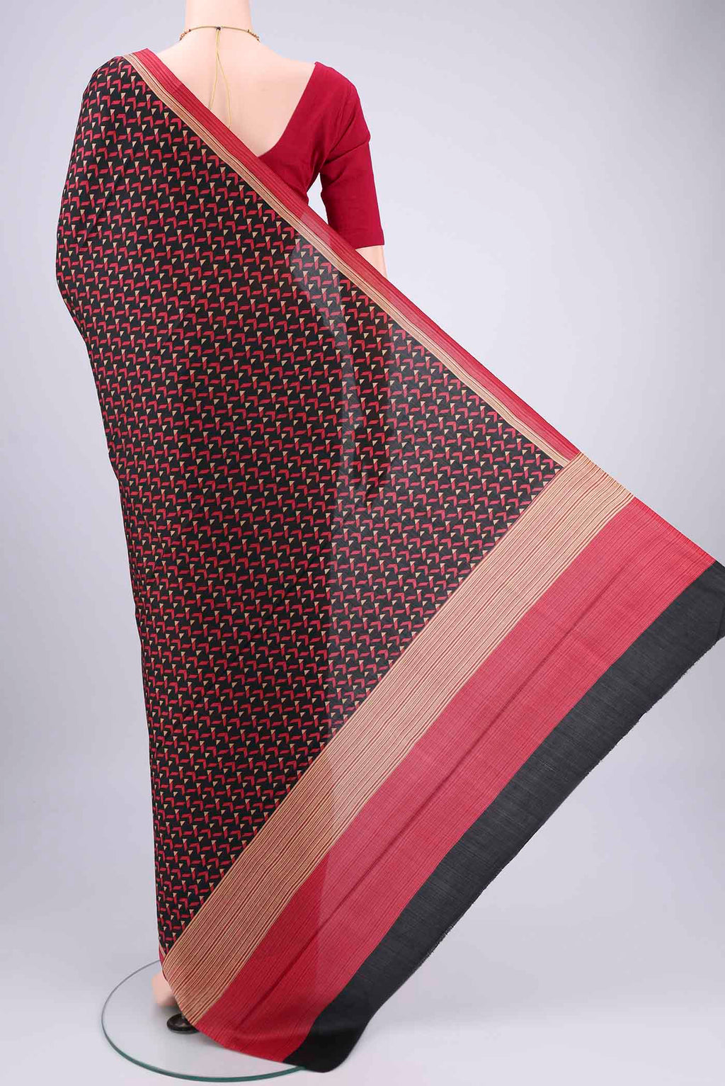 Flat view of Black Printed Silk Saree with Floral Print on the body and Printed Border. 