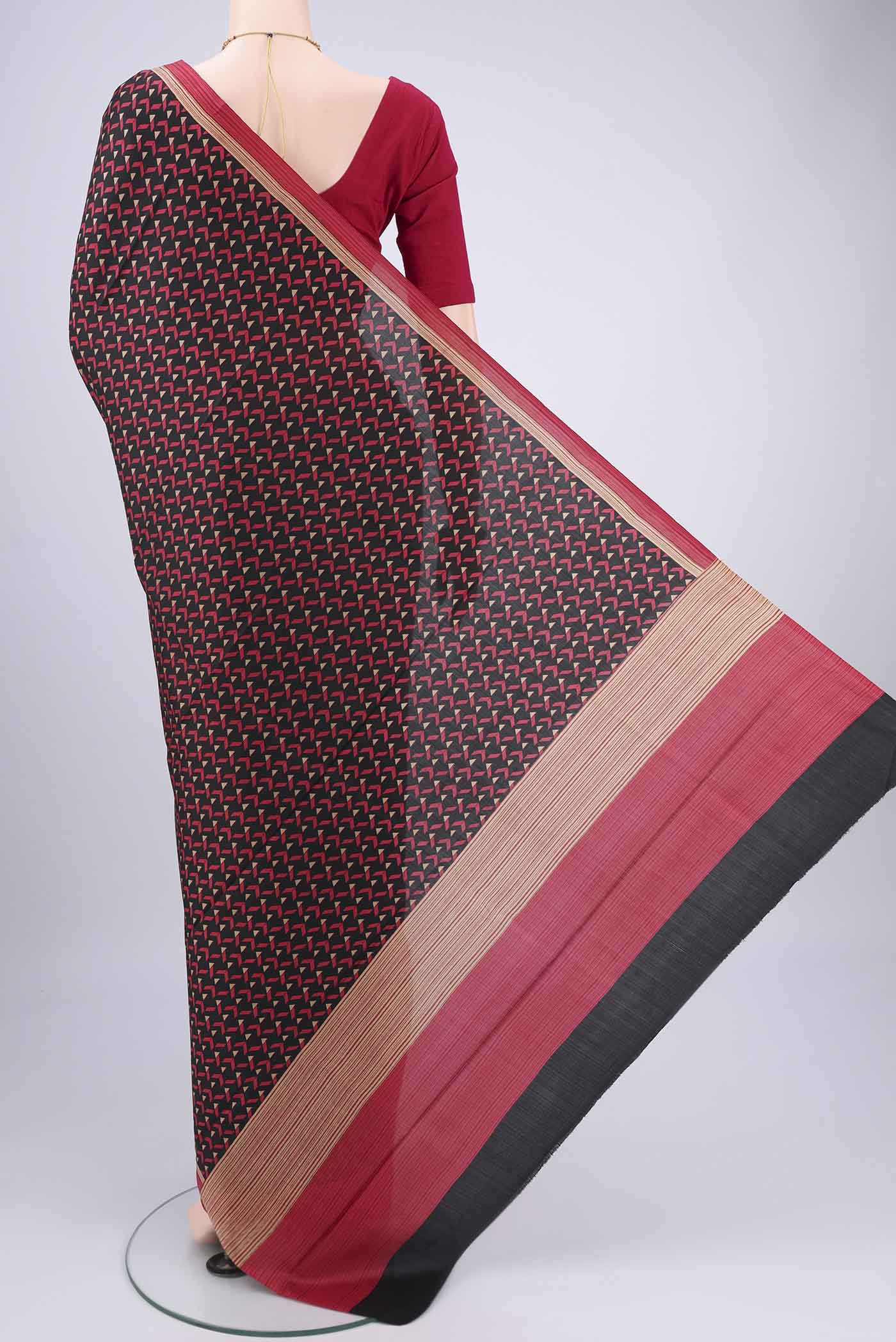 Flat view of Black Printed Silk Saree with Floral Print on the body and Printed Border. 