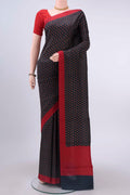 Navy Blue Printed Silk Saree with Printed design on the body and Lace Border displayed on a mannequin